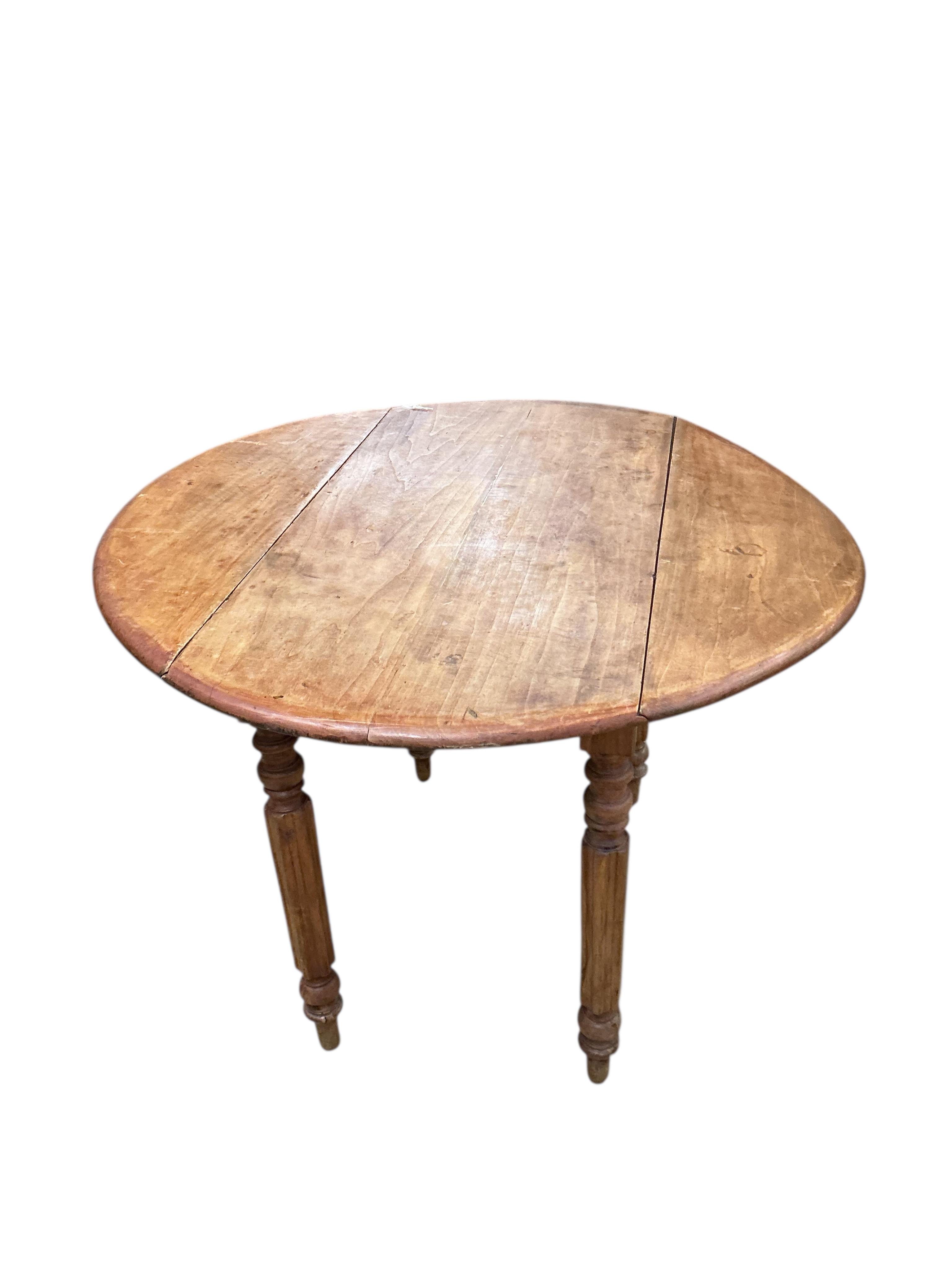 A 19th century French fruitwood drop flap table, width 98cm, depth 49cm, height 66cm